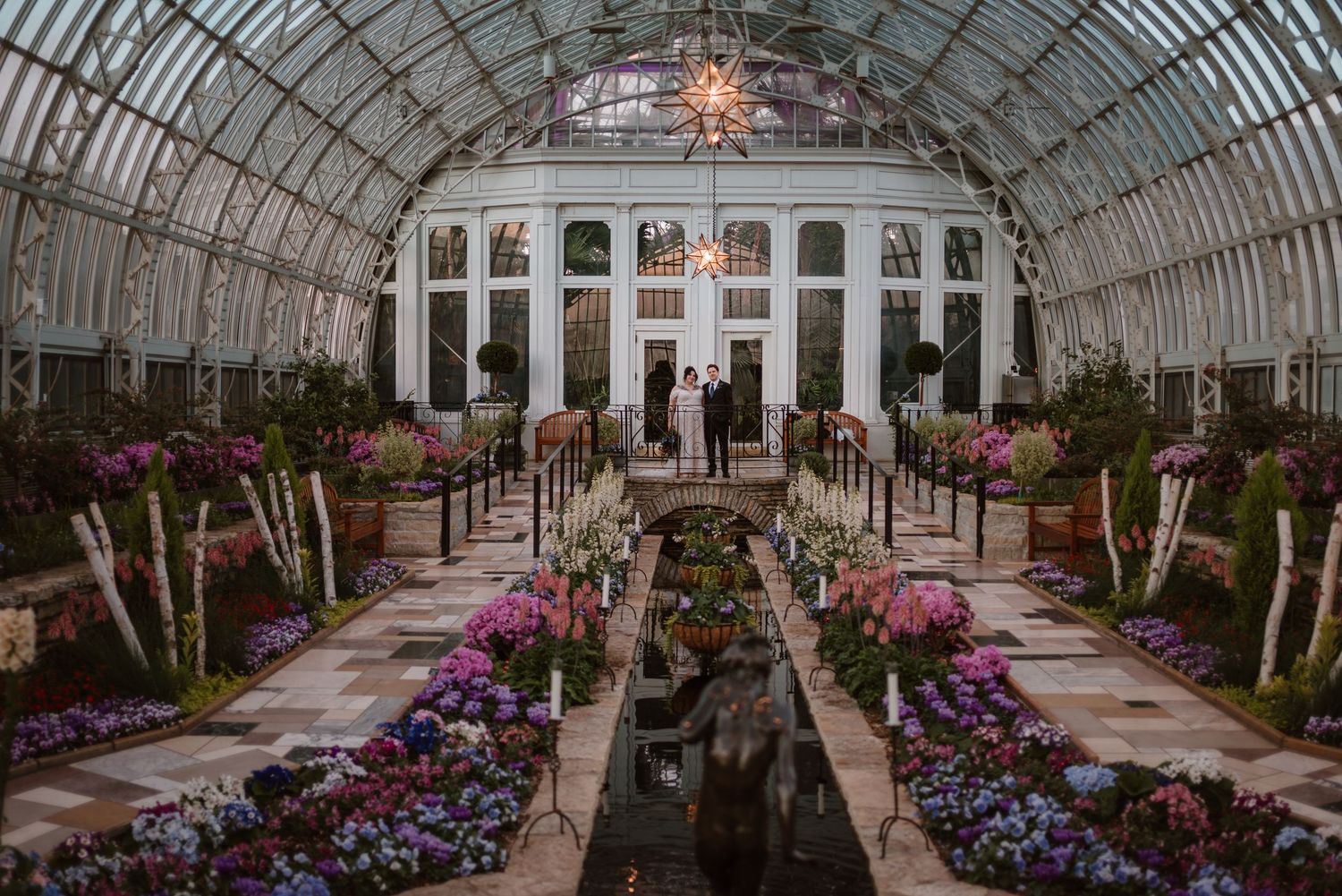 Couple sharing a quiet moment together after their ceremony at Como Conservatory