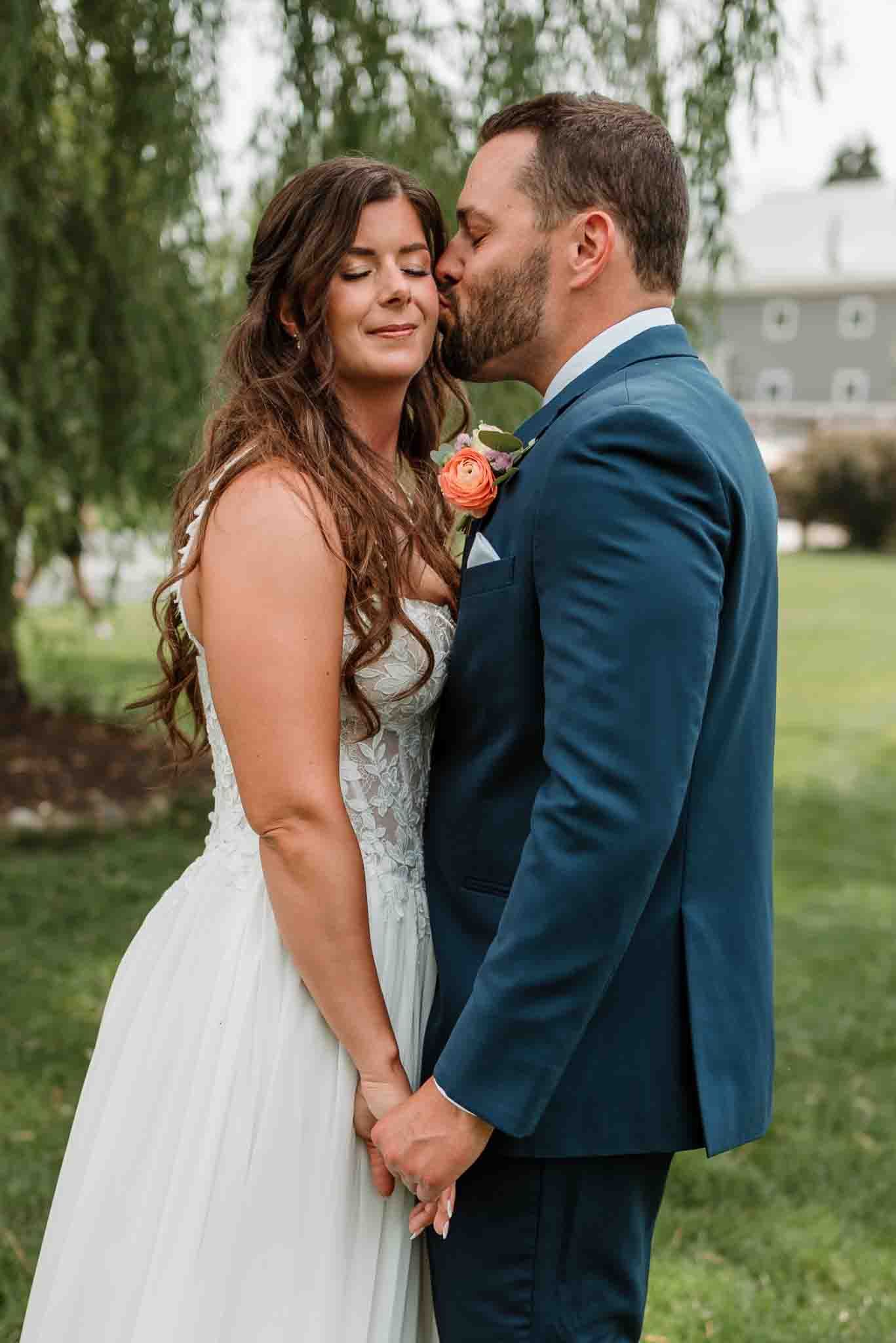 Couple sharing a quiet moment together after their ceremony at Harvest Moon Pond