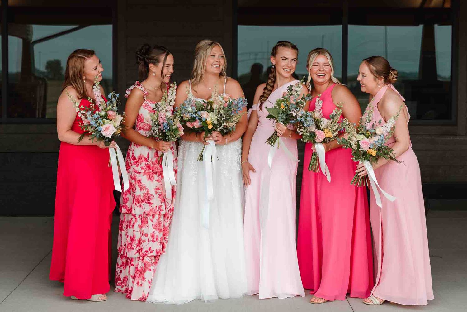 Bride laughing with her bridesmaids at The Crescent in Eau Claire