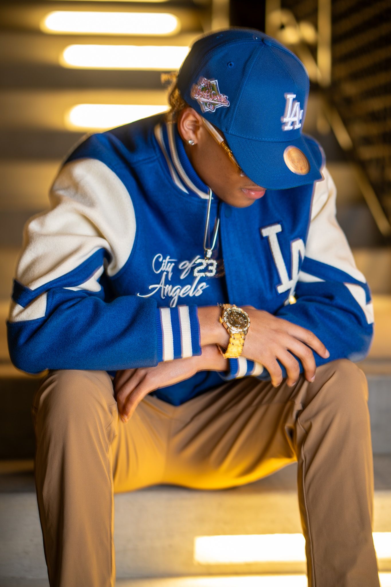 College basketball model in blue jacket downtown Atlanta. Vera-Lane's Photography & Media