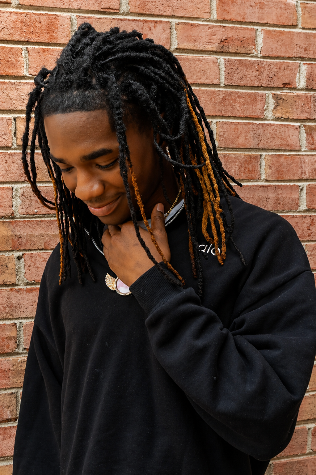 High School senior photos in black polo. Vera-Lane's Photography & Media