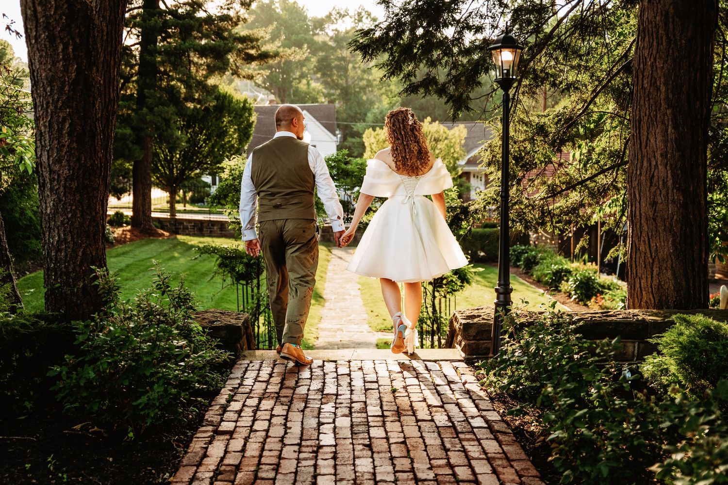 Bride and groom stroll through the garden at Highgate Carriage House | west virginia wedding photographer | fairmont wv