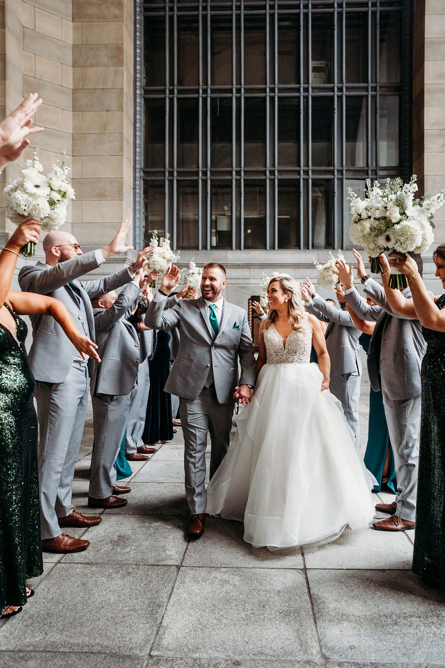 Bride and groom go through bridal party tunnel in Pittsburgh, PA | Pennsylvania wedding | pittsburgh wedding | wedding photographer