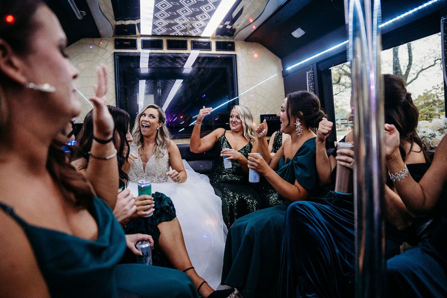 Bride and bridesmaids celebrate on a party bus. Pittsburgh, PA