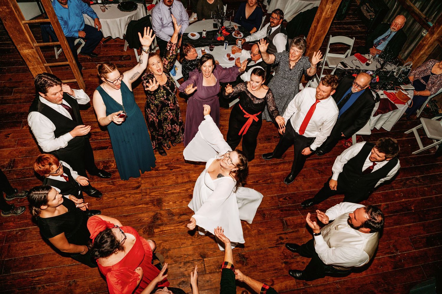 Bride dances among her friends and family during her reception at Deer Creek Winery at Watson Estate in Uniontown, PA | Pennsylvania wedding