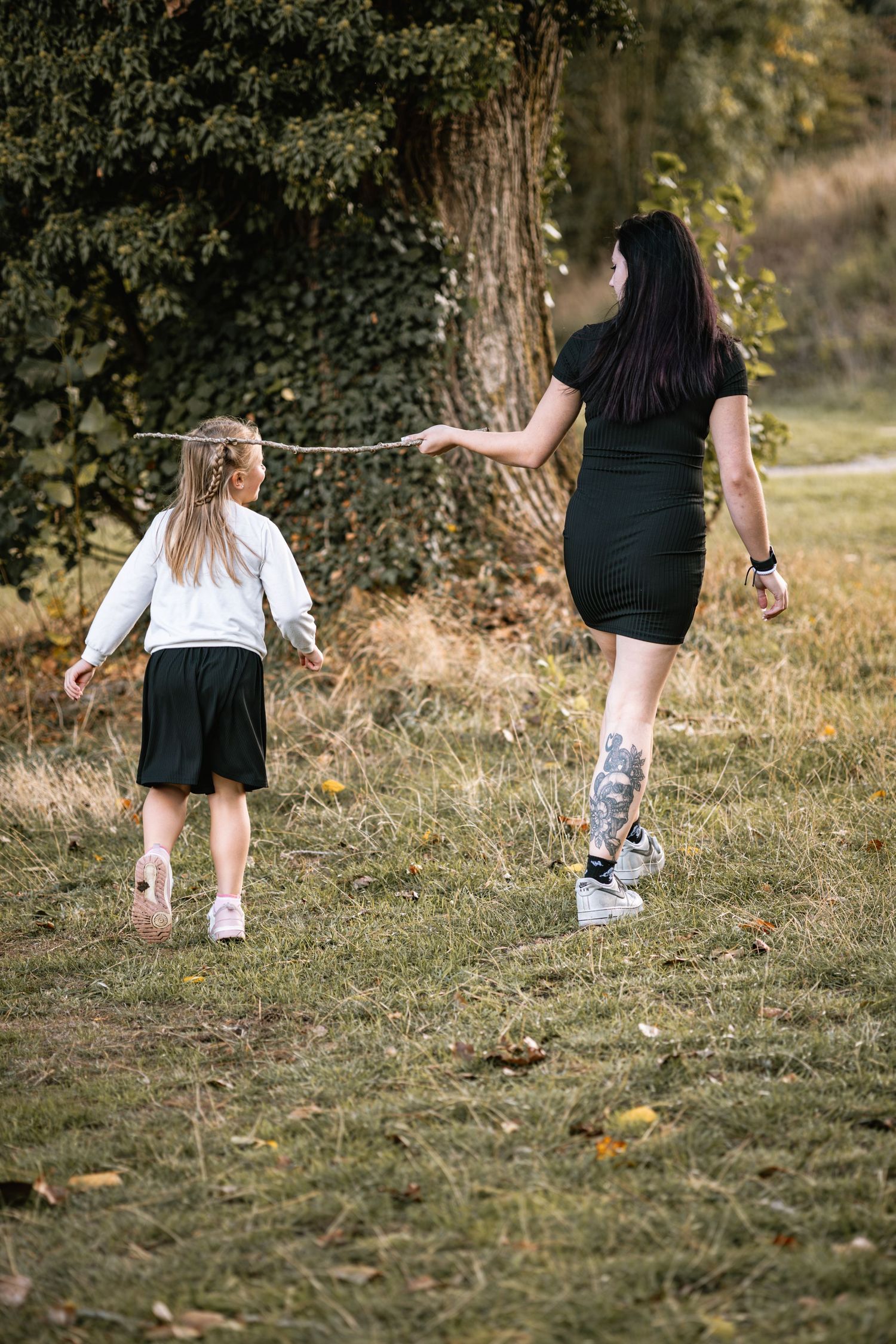A sequence of photos showing legs walking through grass in a natural outdoor setting during daytime.