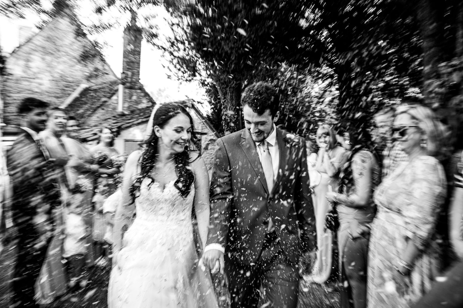 A collection of vintage black and white wedding photographs arranged in a filmstrip style layout.
