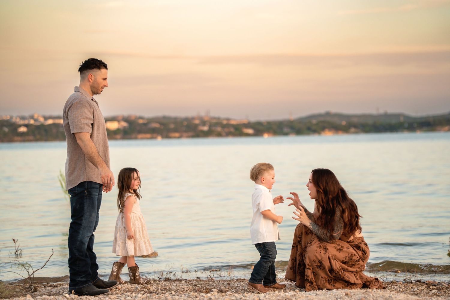 Family spending time together at sunset by peaceful waterfront.