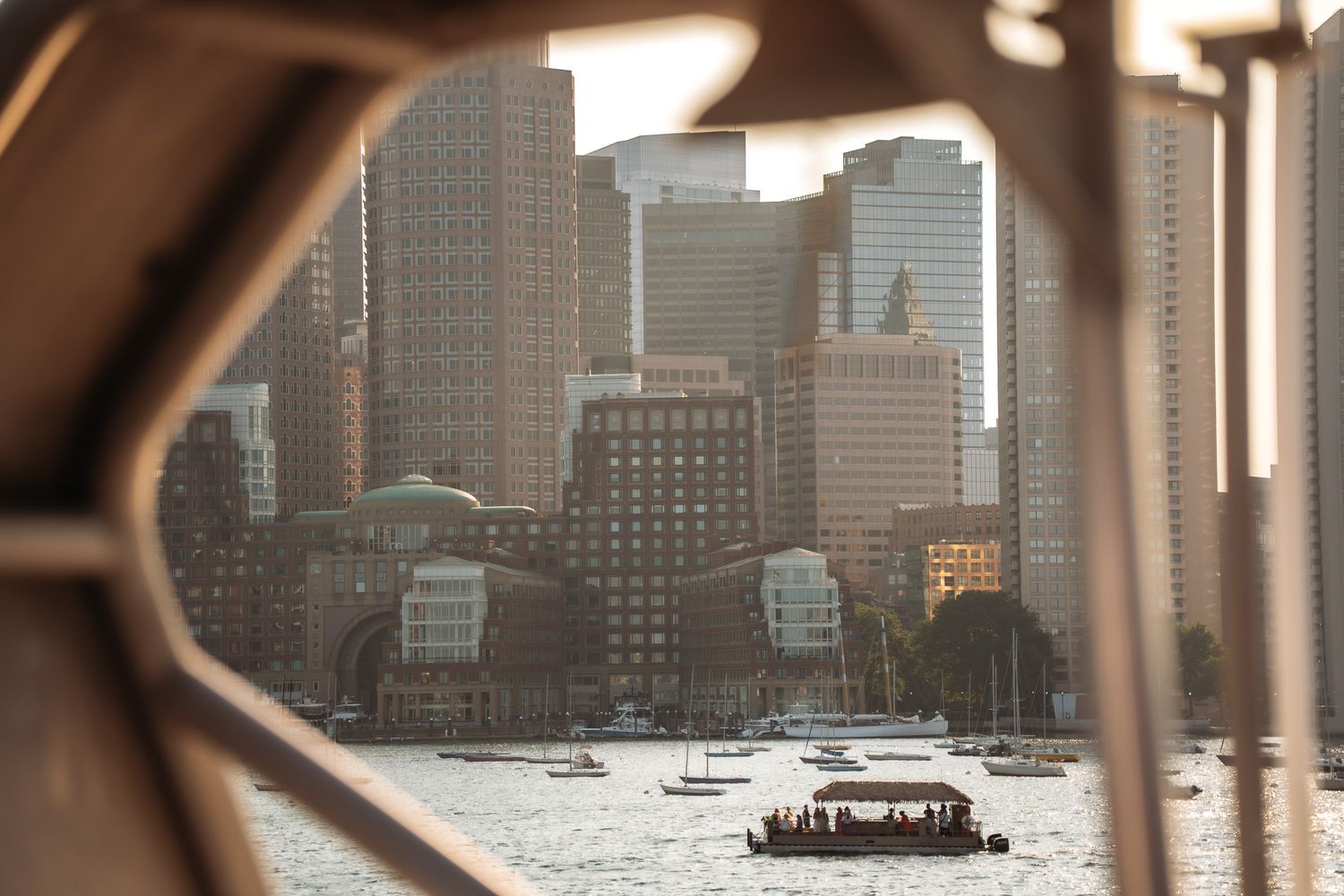 Urban waterfront skyline view through architectural framing elements.