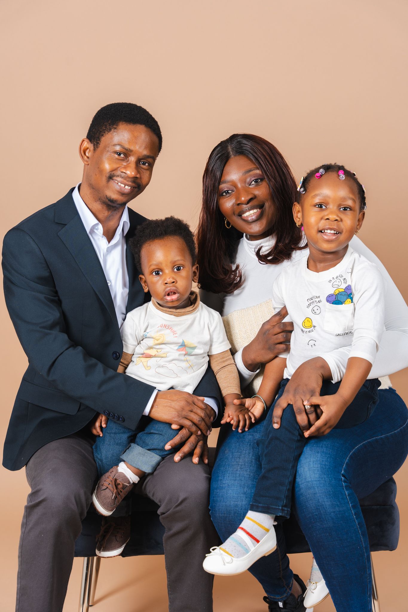 A series of casual family photos showing joyful moments and interactions against a neutral beige backdrop.