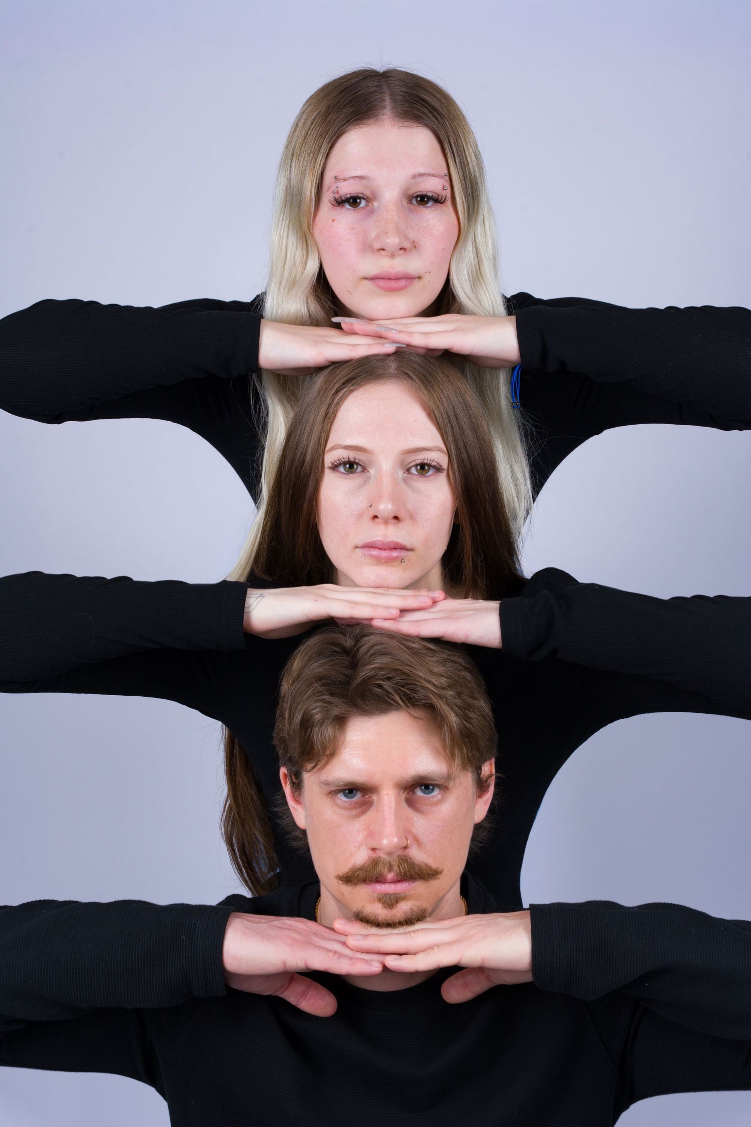 Creative photo series showing hands framing faces against a black and white background.