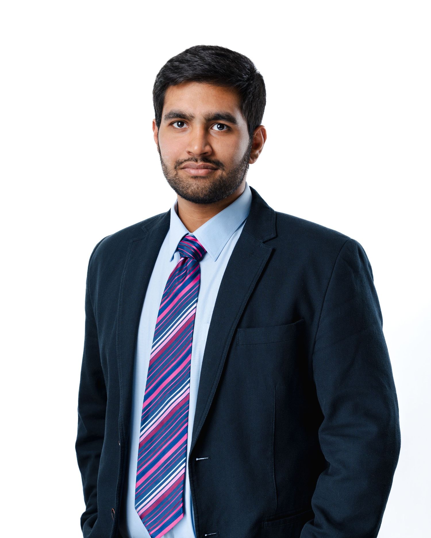 Professional wearing a navy suit and striped purple tie shown in three different poses against white background.