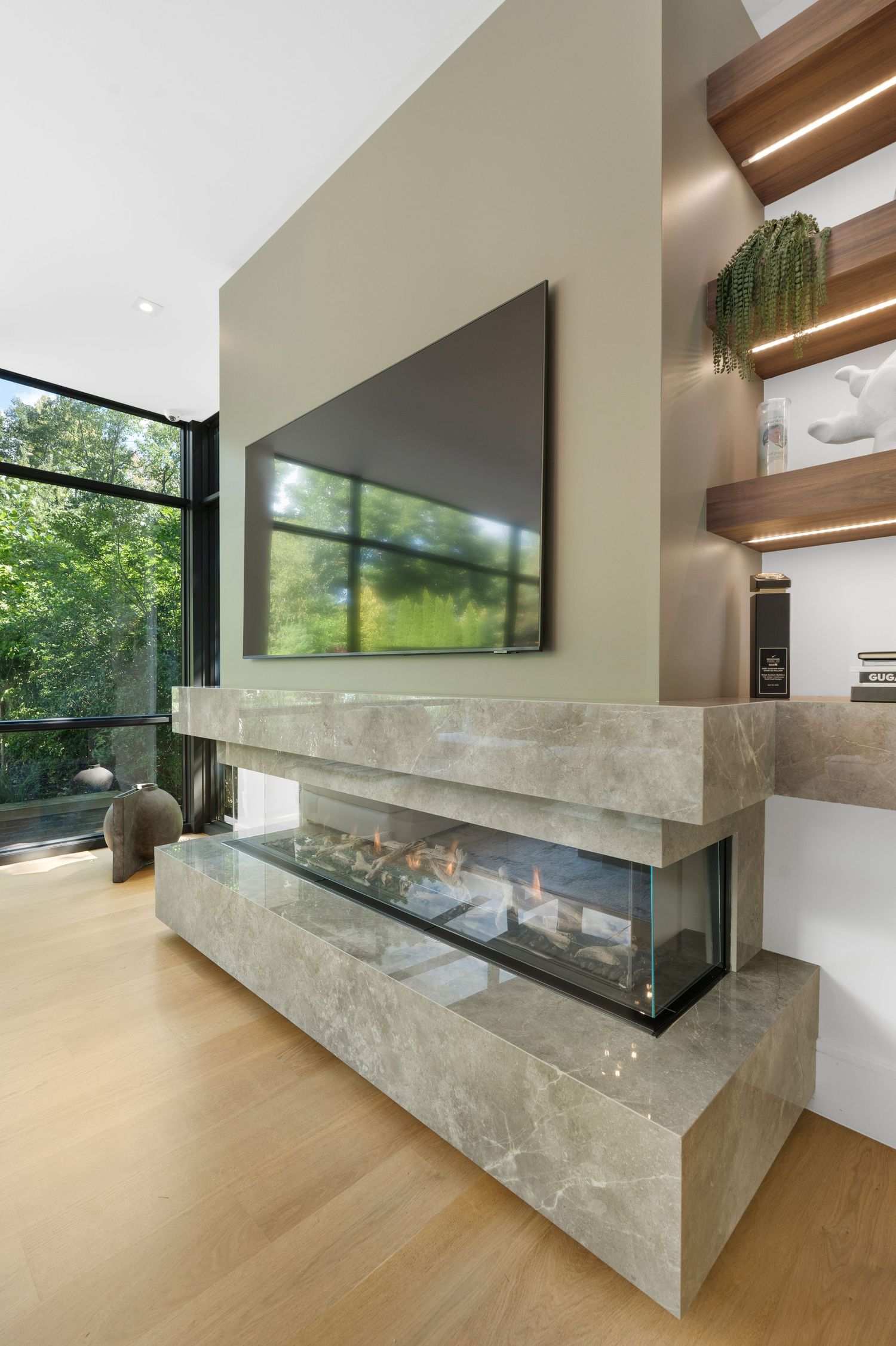 Luxurious marble staircase with floating steps and wooden accents in a modern interior setting.
