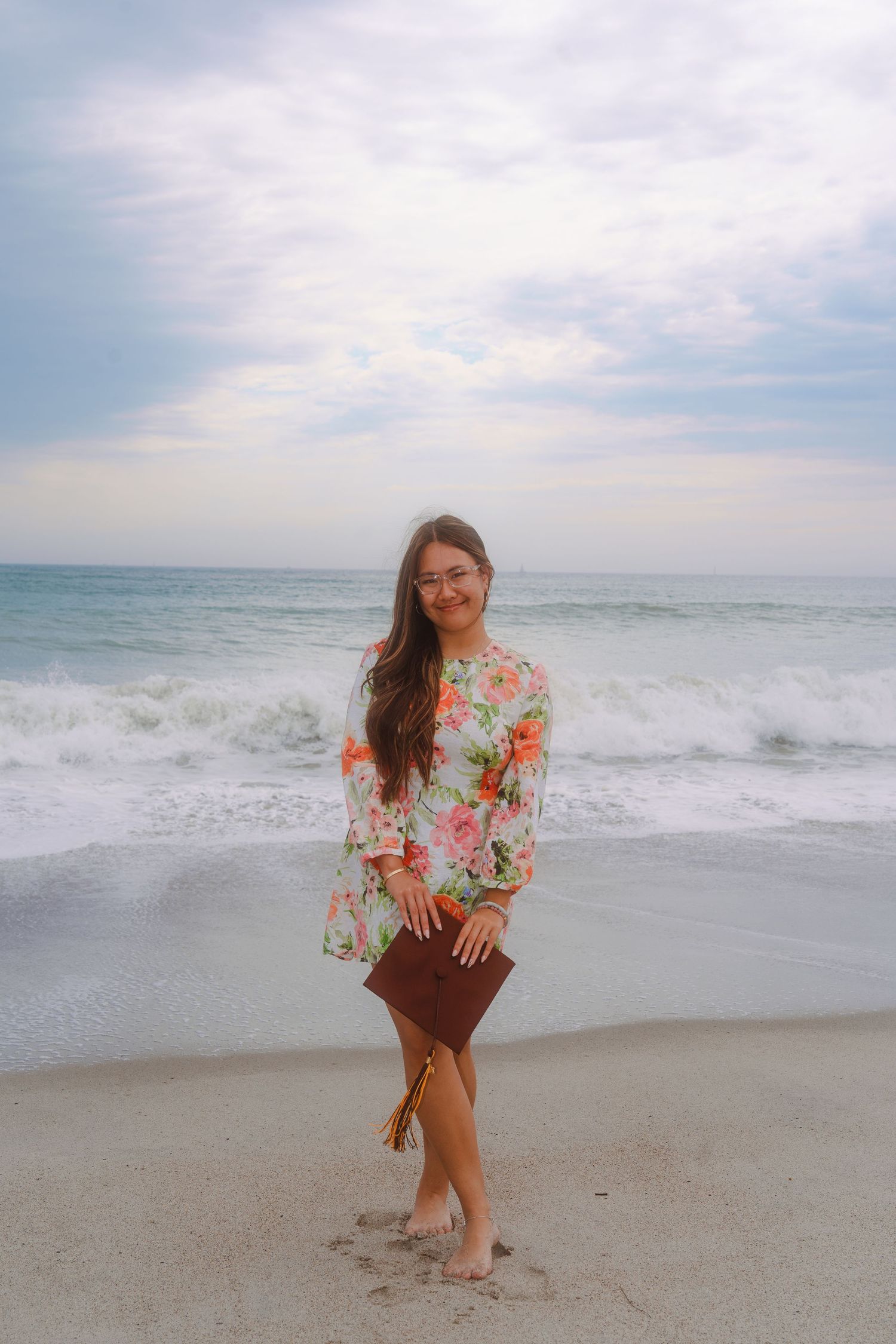 graduation photo of a girl at the beach