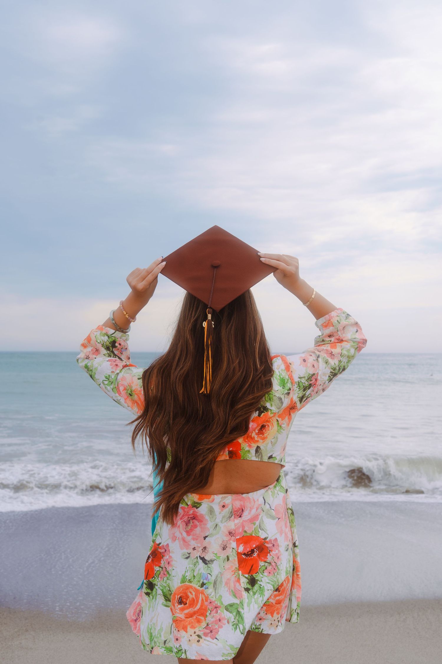 graduation photo of a girl at the beach