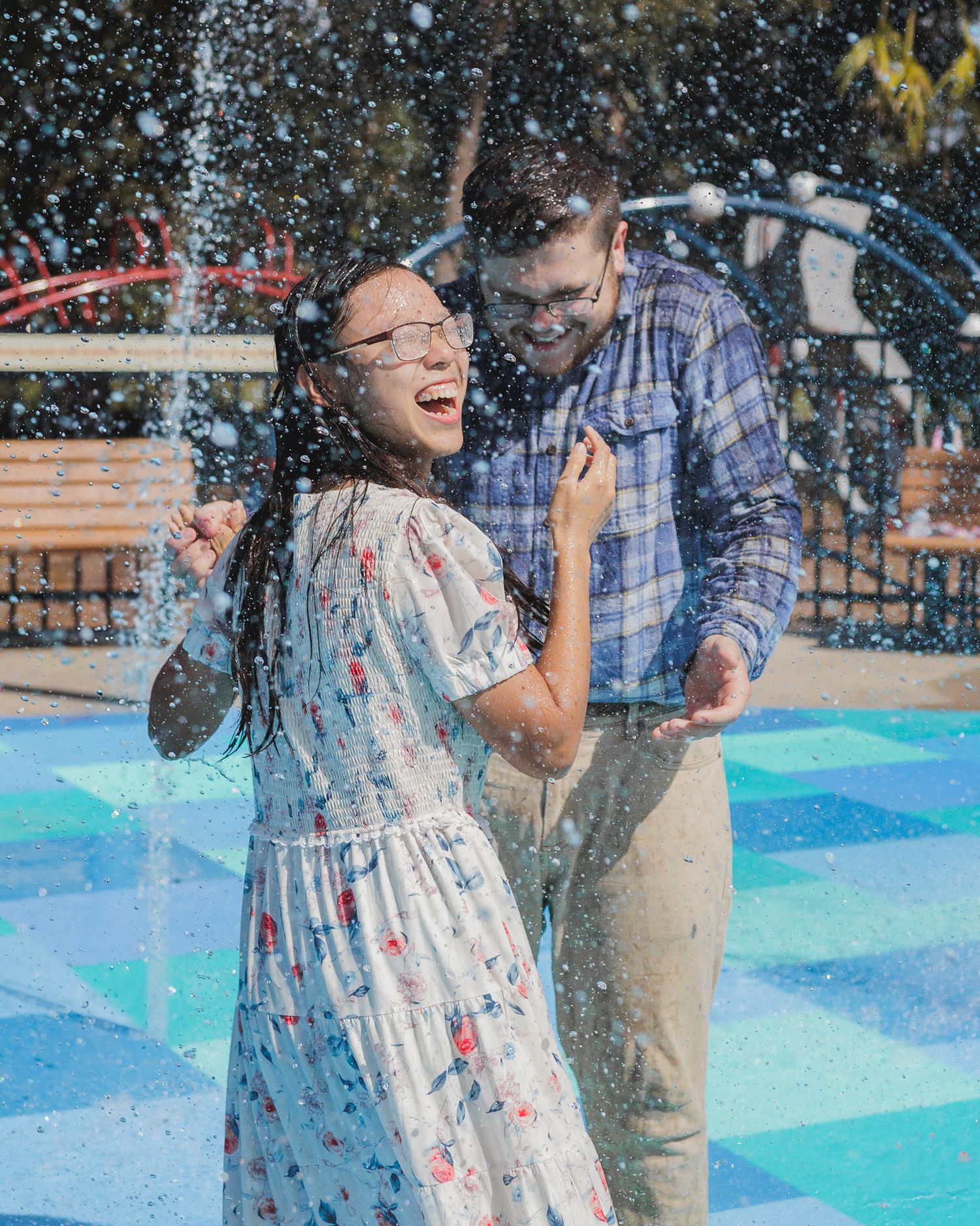 A couple playing and having fun at a waterpark