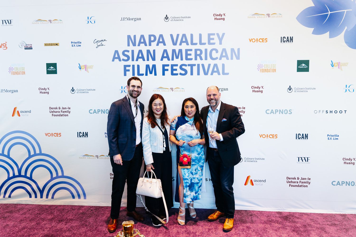 A group of attendees pose on the red carpet at the Napa Valley Asian American Film Festival.