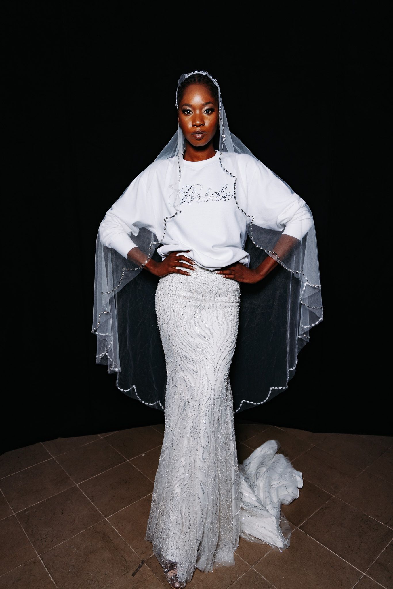 Bride wearing a classic white lace wedding gown with veil poses against dark background in multiple angles.