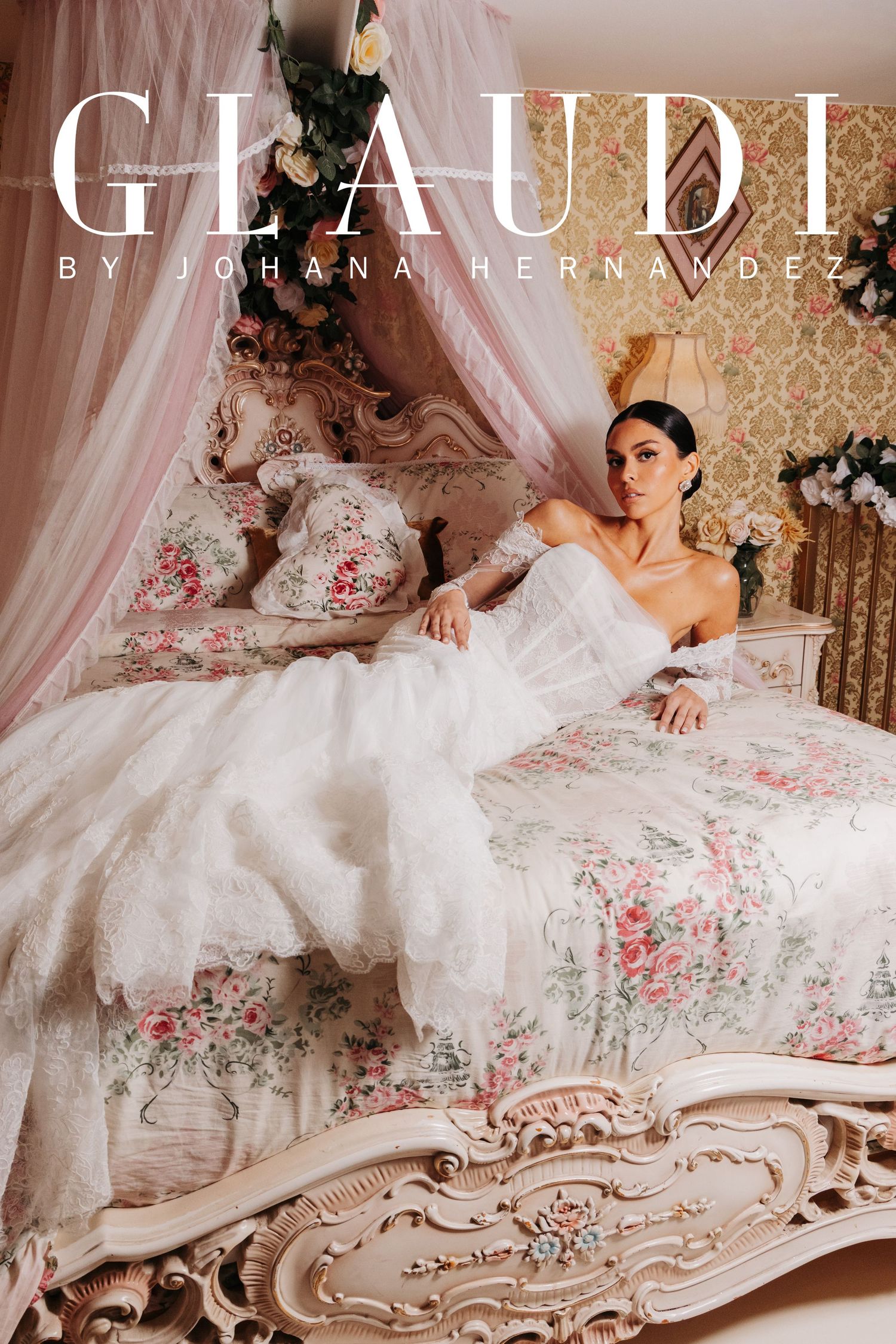 A model in a white off-shoulder ball gown reclines on an ornate floral bed in a GLAUDI by Johana Hernandez bridal editorial.