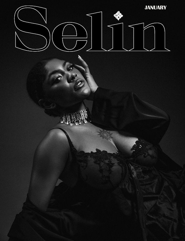 Dramatic black and white fashion portrait with elegant jewelry and January text overlay.