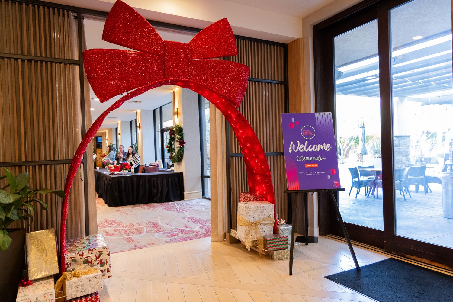 Grand opening celebration with red ribbon decor and balloons in a modern retail space interior.