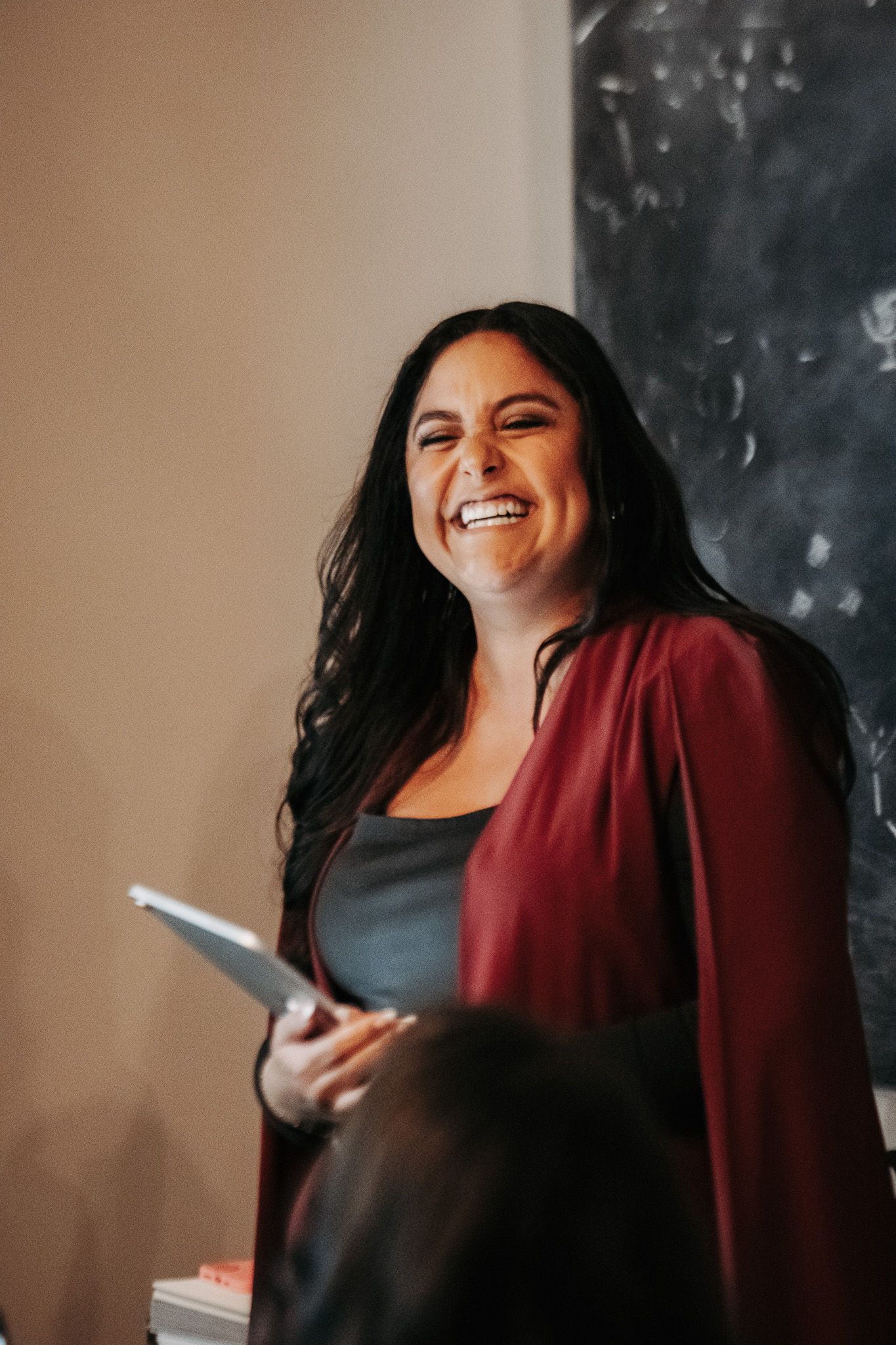 A series of candid shots showing joyful expressions and laughter in warm lighting.