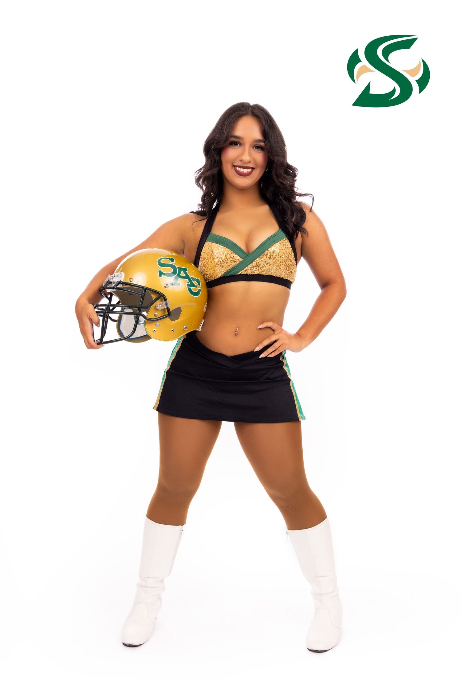 Saskatchewan Roughriders cheerleader performs dance moves in green and yellow uniform with white boots.