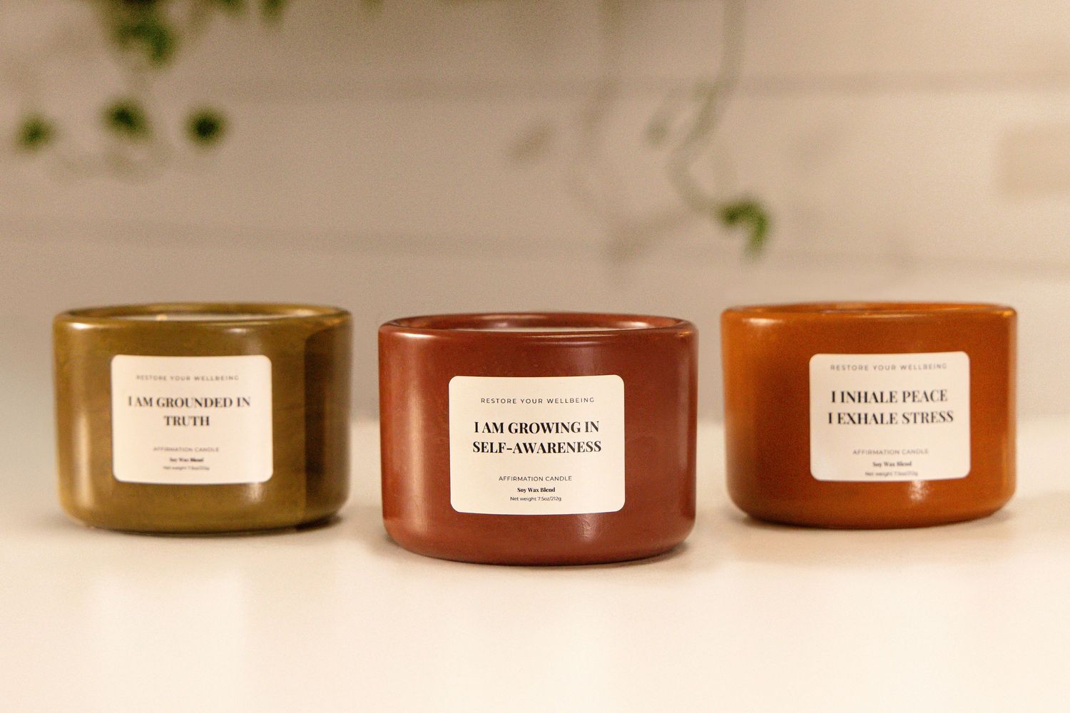 Row of amber and terracotta colored glass jars with white labels on display.