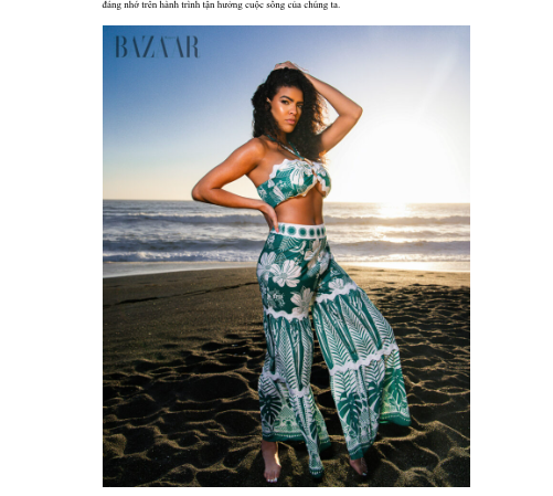 Woman in green floral two-piece outfit posing on beach, featured in Harper's Bazaar fashion editorial.