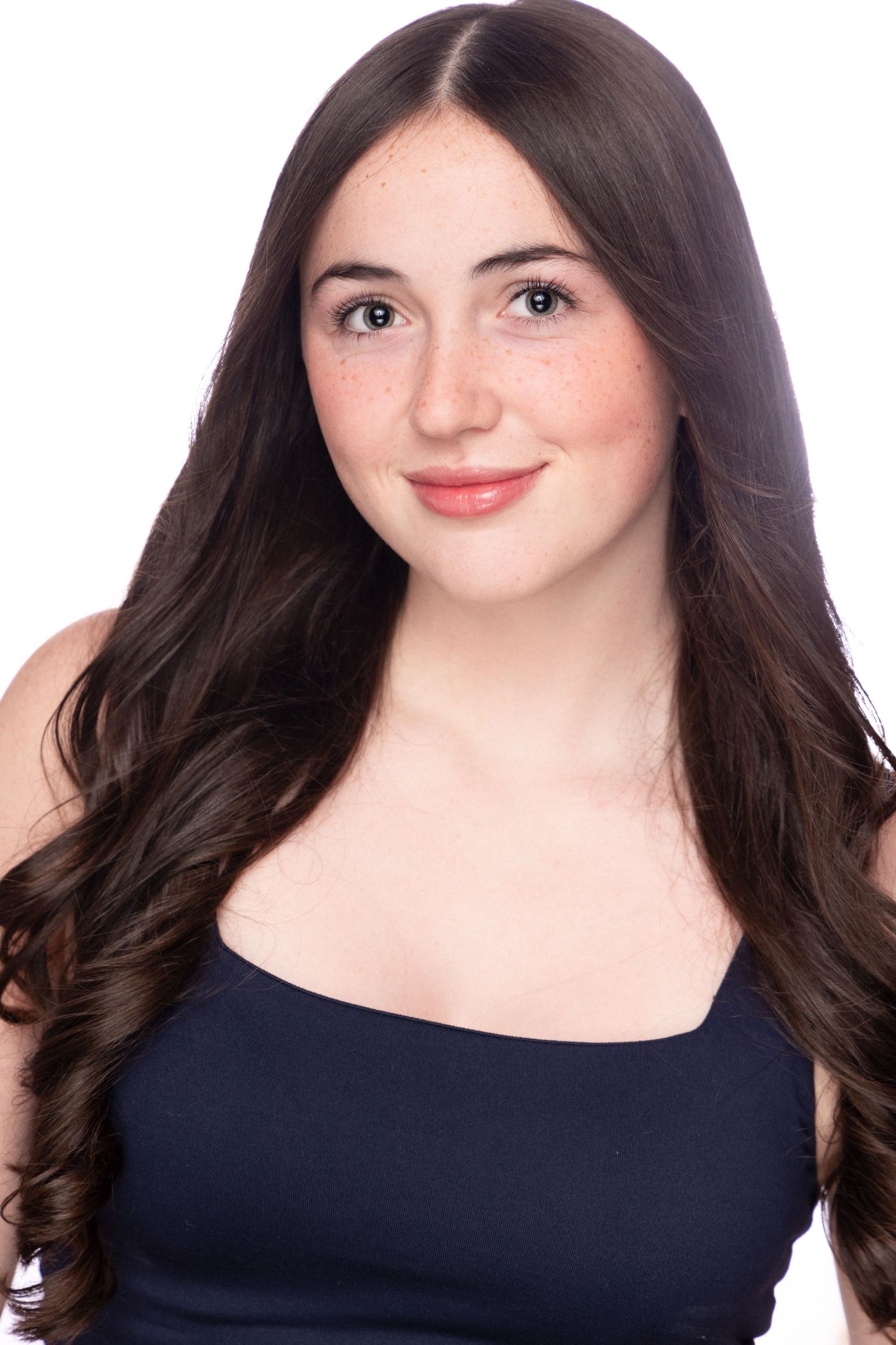 Portrait series showing four similar poses with dark hair and navy top against light background.