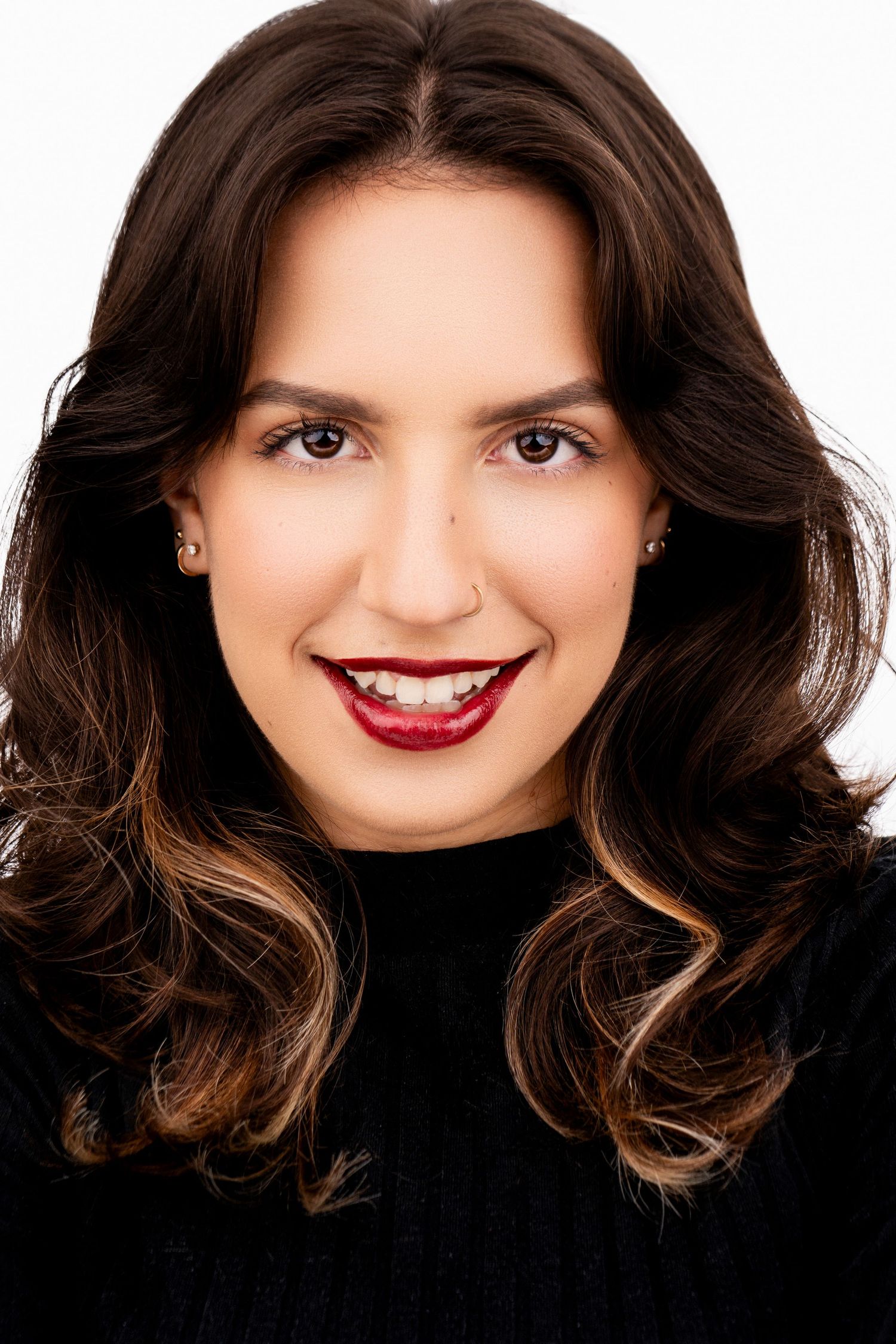 A series of five headshots showing dark wavy hair and red lipstick against a black background.