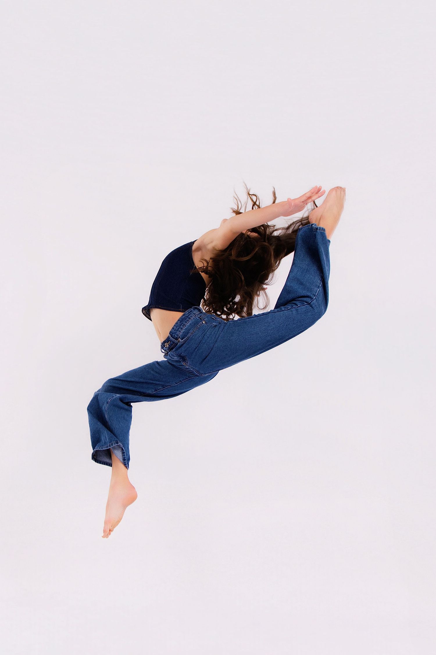 A sequence of dance poses shows a performer in navy blue attire executing a graceful backward arch movement.