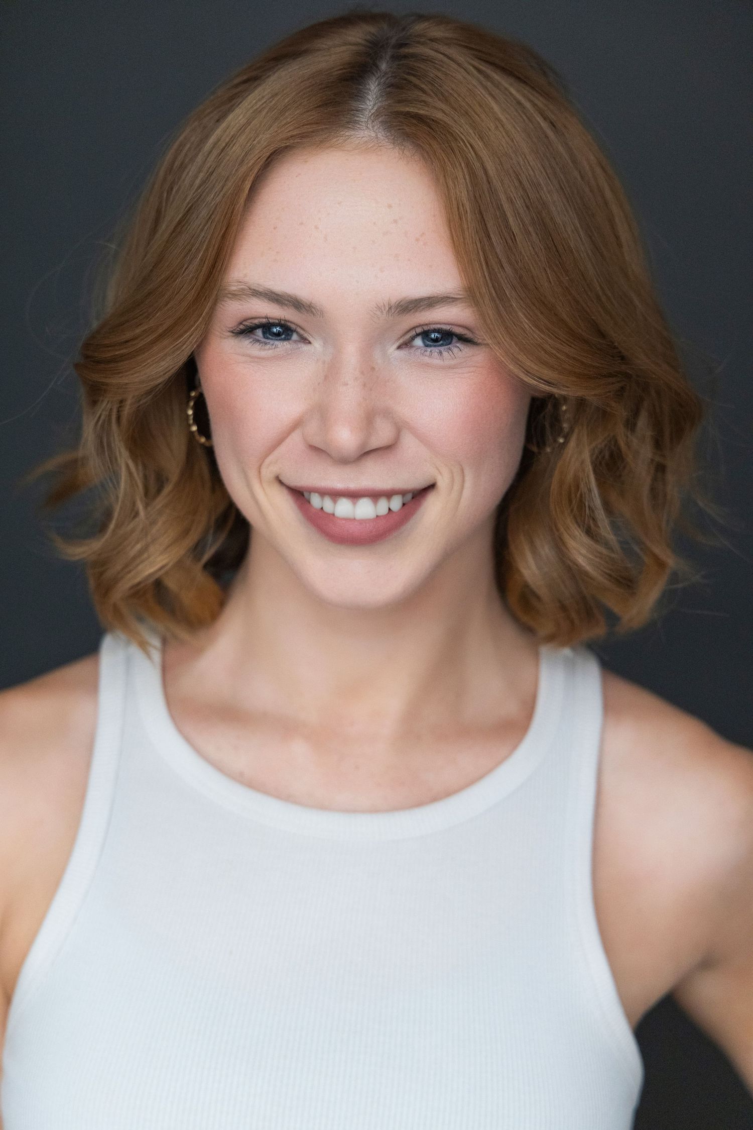 A sequence of headshots showing bright smiles and wavy brown hair against a dark background.
