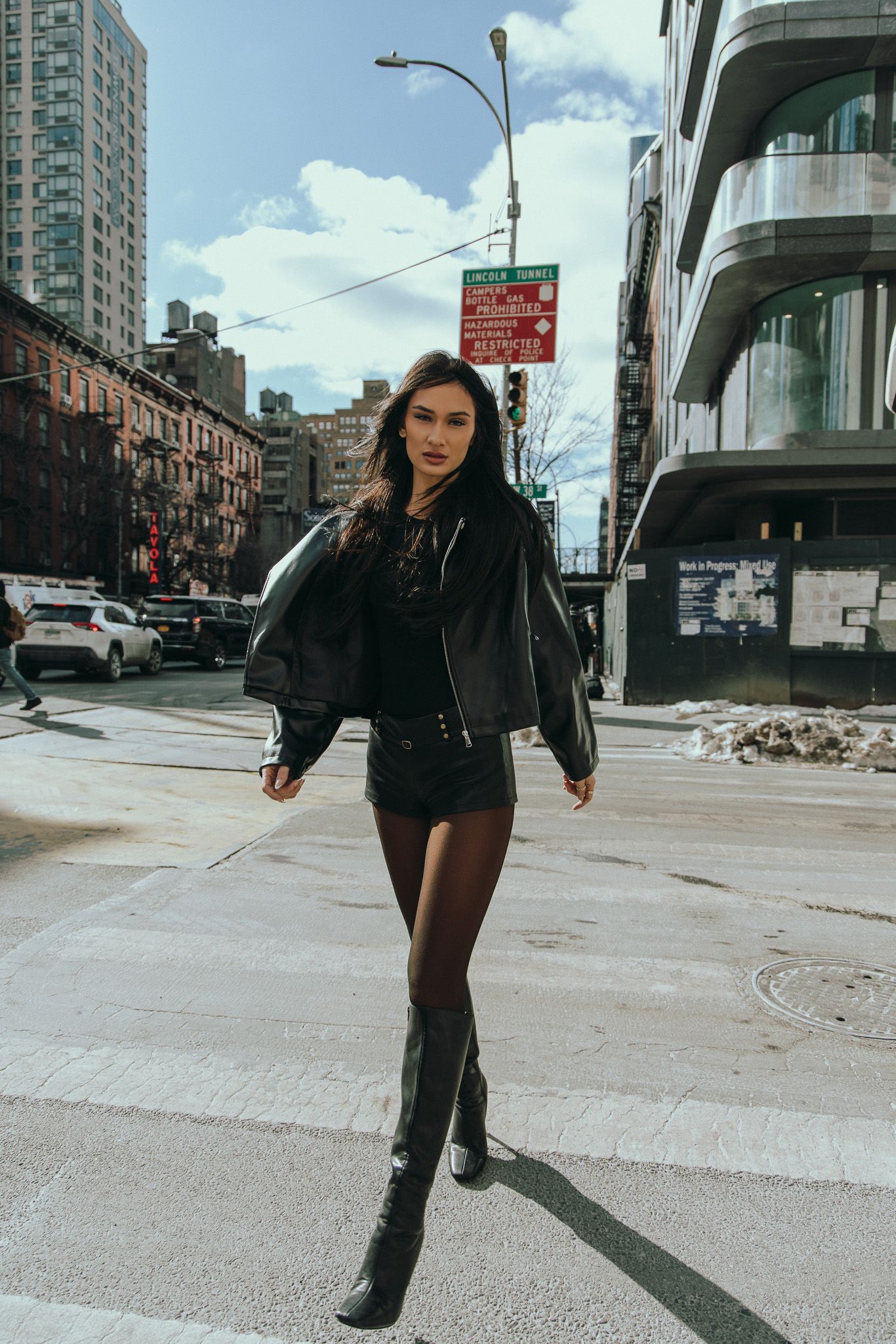 Urban fashion photography series showing edgy street style poses in a city setting with black boots and outerwear.