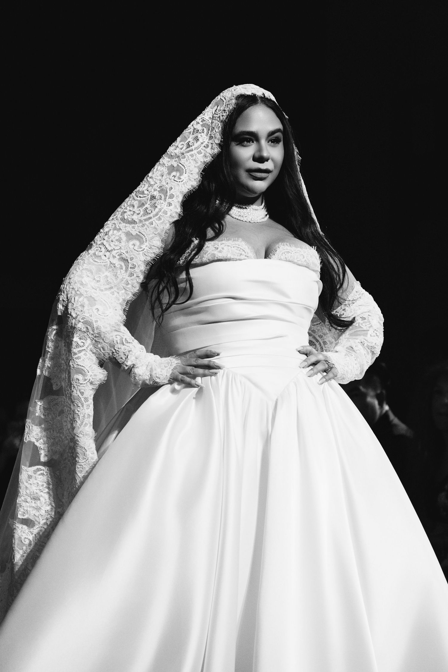 A black and white photo series showing different angles of an elegant white wedding dress with lace details.