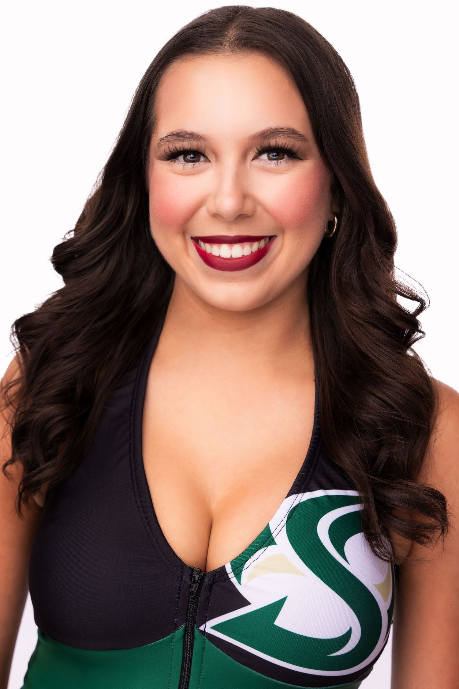 Portrait series in black and green sports top with glamorous makeup and styled waves.