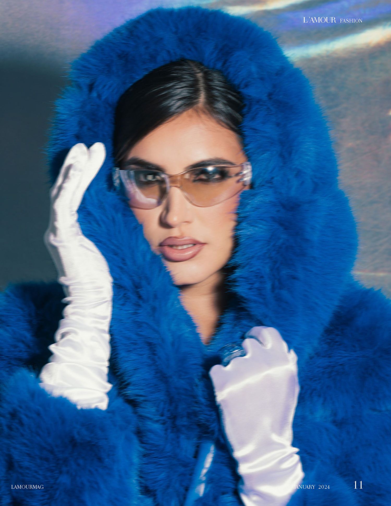 Fashion shot featuring bright blue fur coat, white gloves, and designer sunglasses.