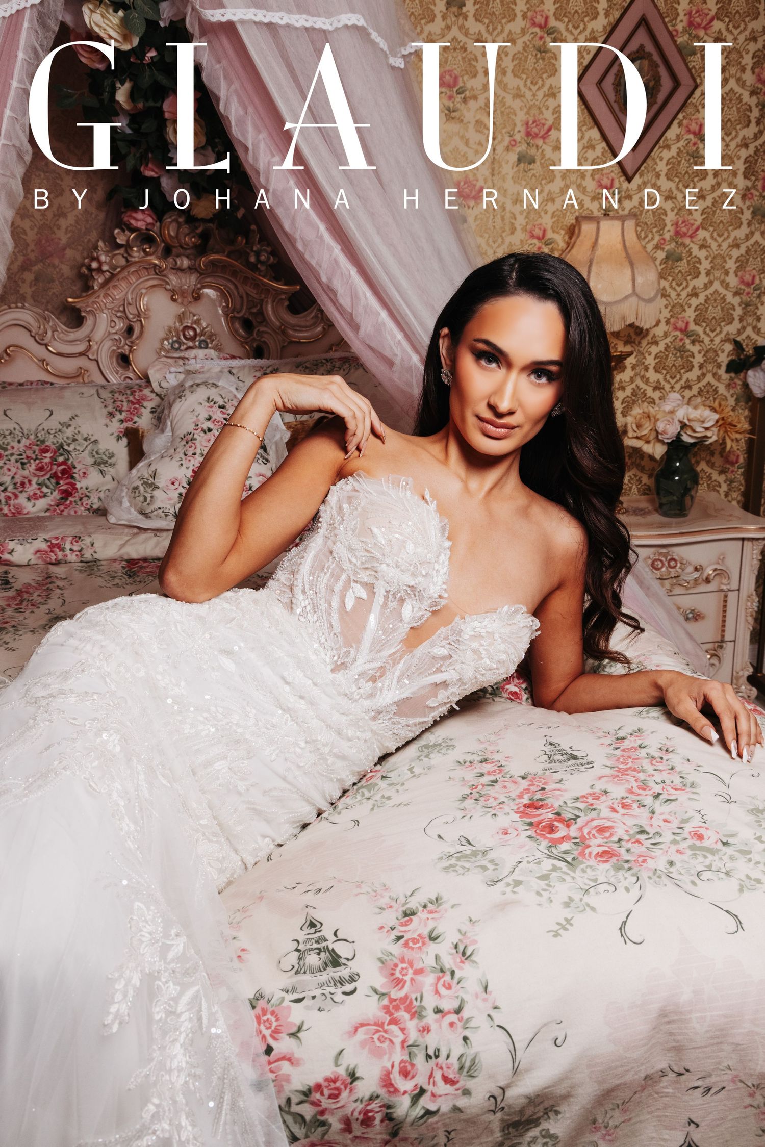 Elegant bride in a strapless lace wedding gown by Glaudi by Johana Hernandez, posing on a floral bed.