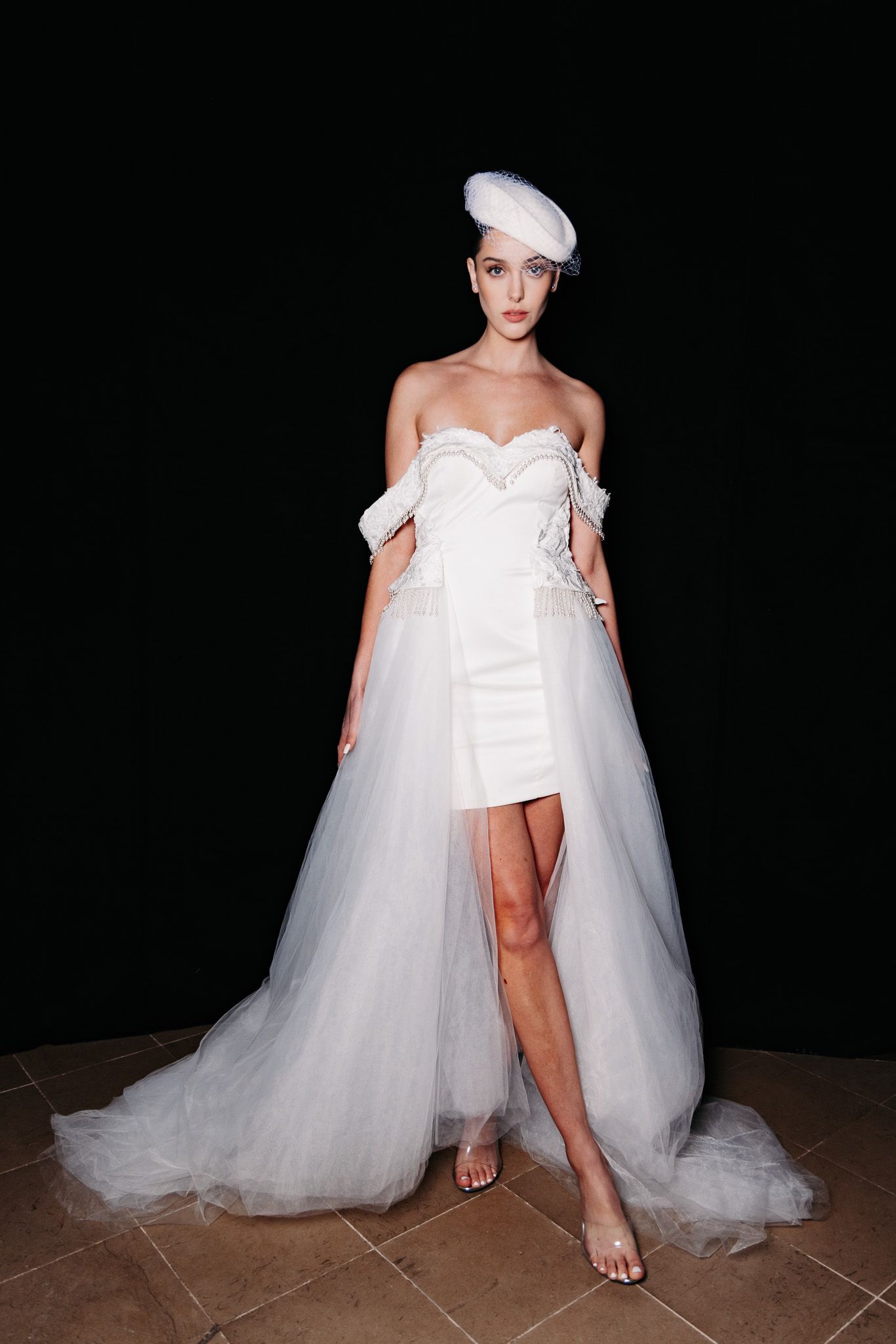 Bridal fashion shoot featuring dramatic white tulle ball gown with sweetheart neckline.