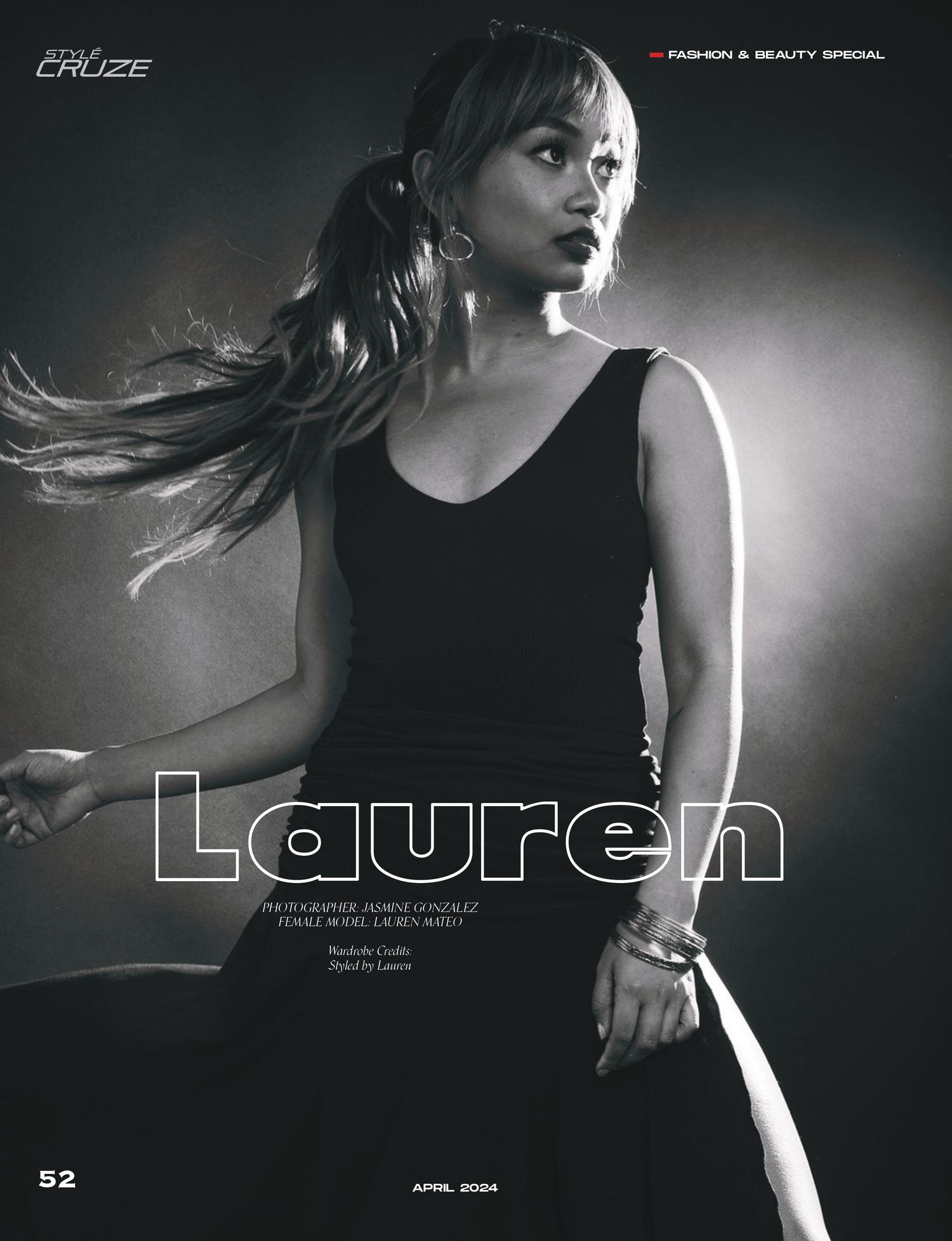 A dramatic black and white fashion editorial photo with flowing hair showcasing a sleek black tank top design.