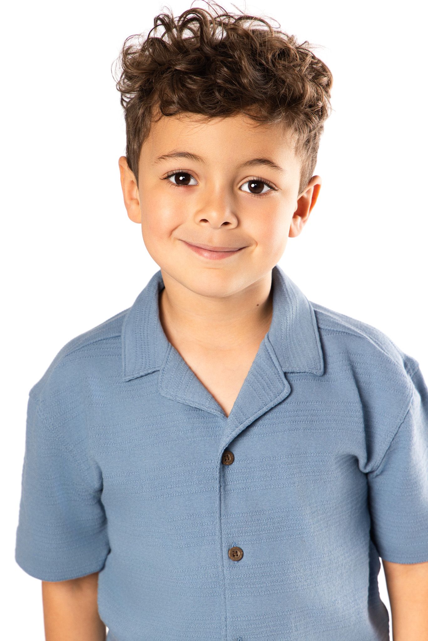 Young child in light blue polo shirt shown in multiple poses against white background.