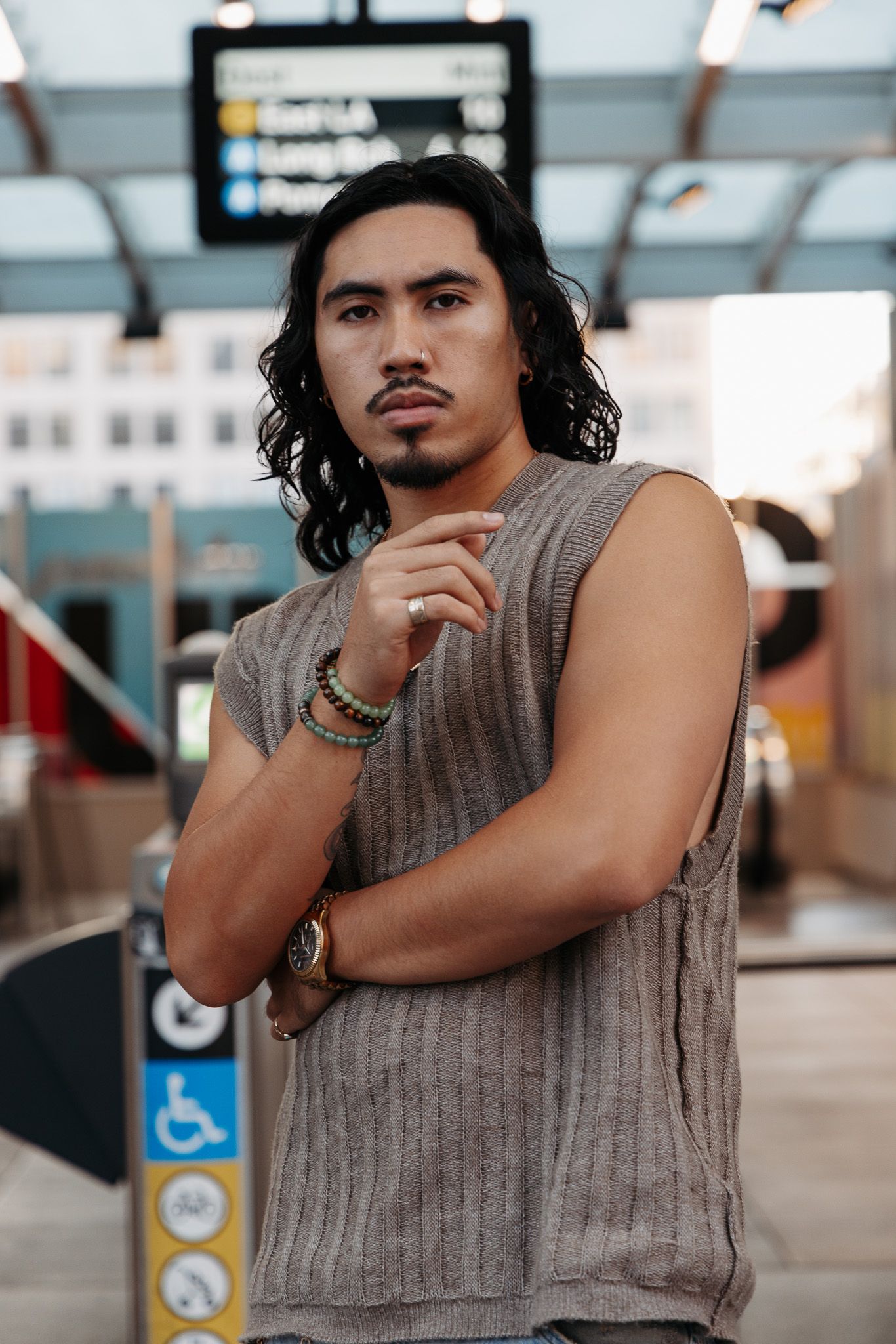 Series of portraits showing a person in a sleeveless top posing thoughtfully in an indoor setting.