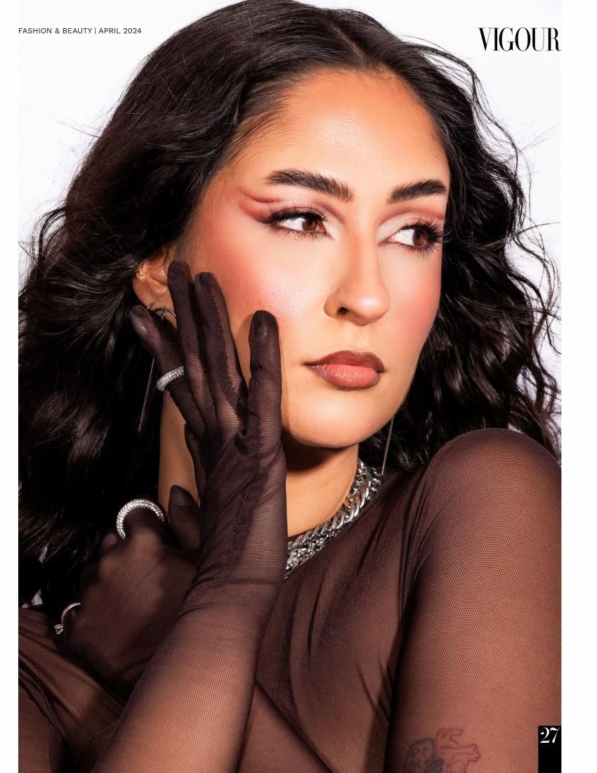 Glamour beauty shot featuring sheer fabric, dramatic makeup, and elegant jewelry styling.