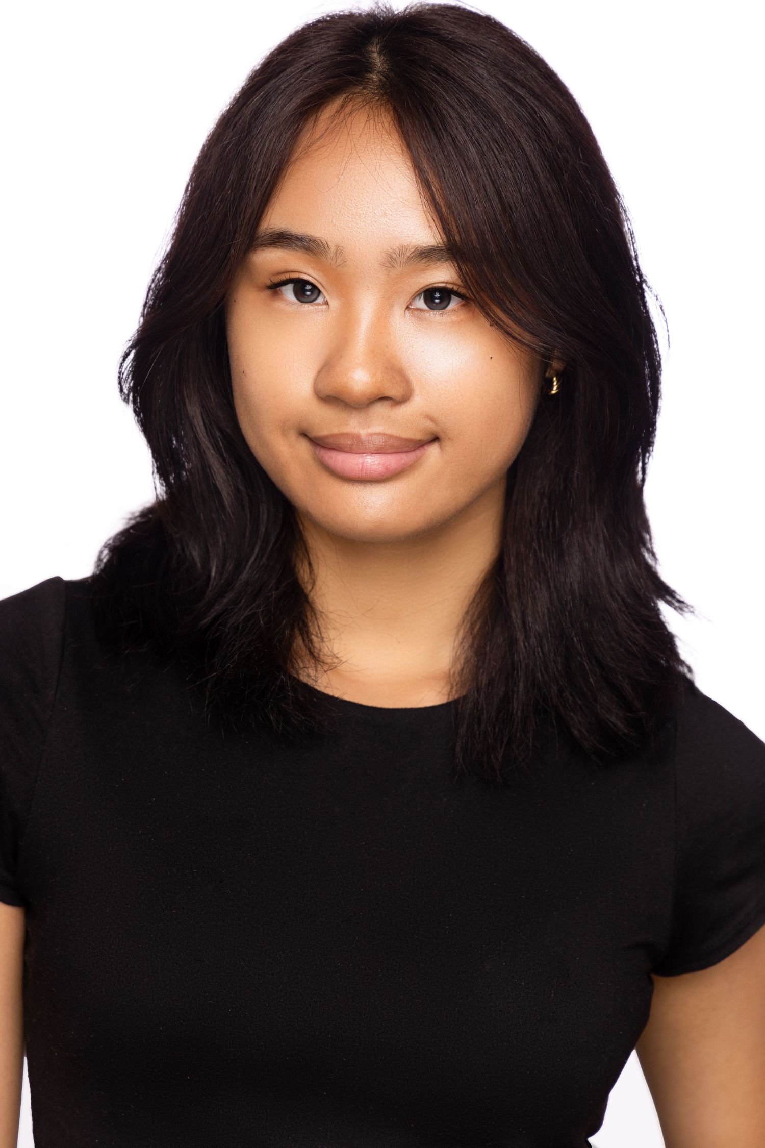 Portrait series showing person with dark hair wearing black shirt against grey background with different facial expressions.