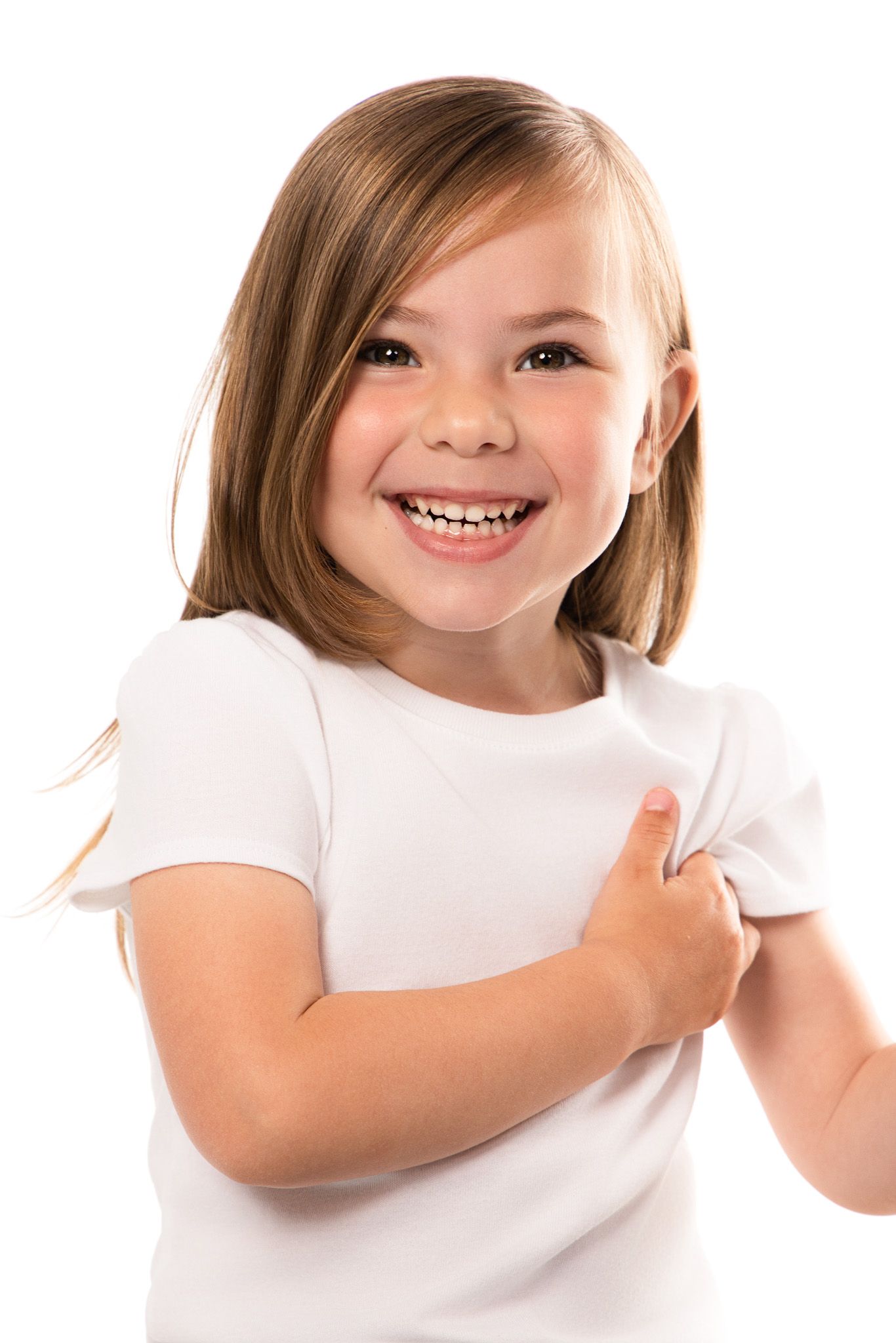 Young child in white t-shirt showing joyful expressions against white background.