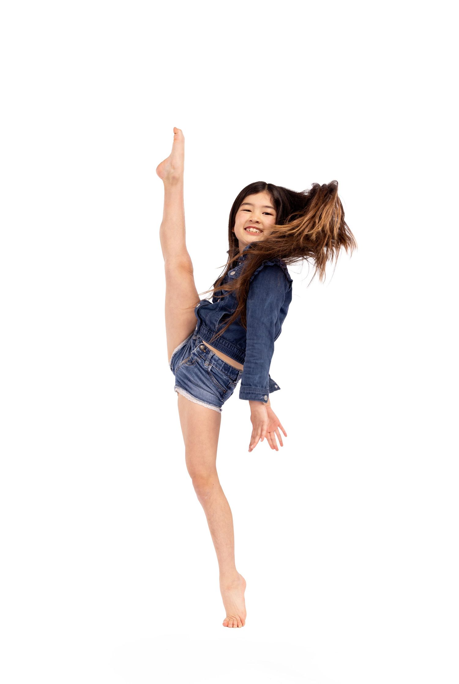 Dancer in casual denim outfit demonstrates dynamic movement sequence with flowing hair motion.