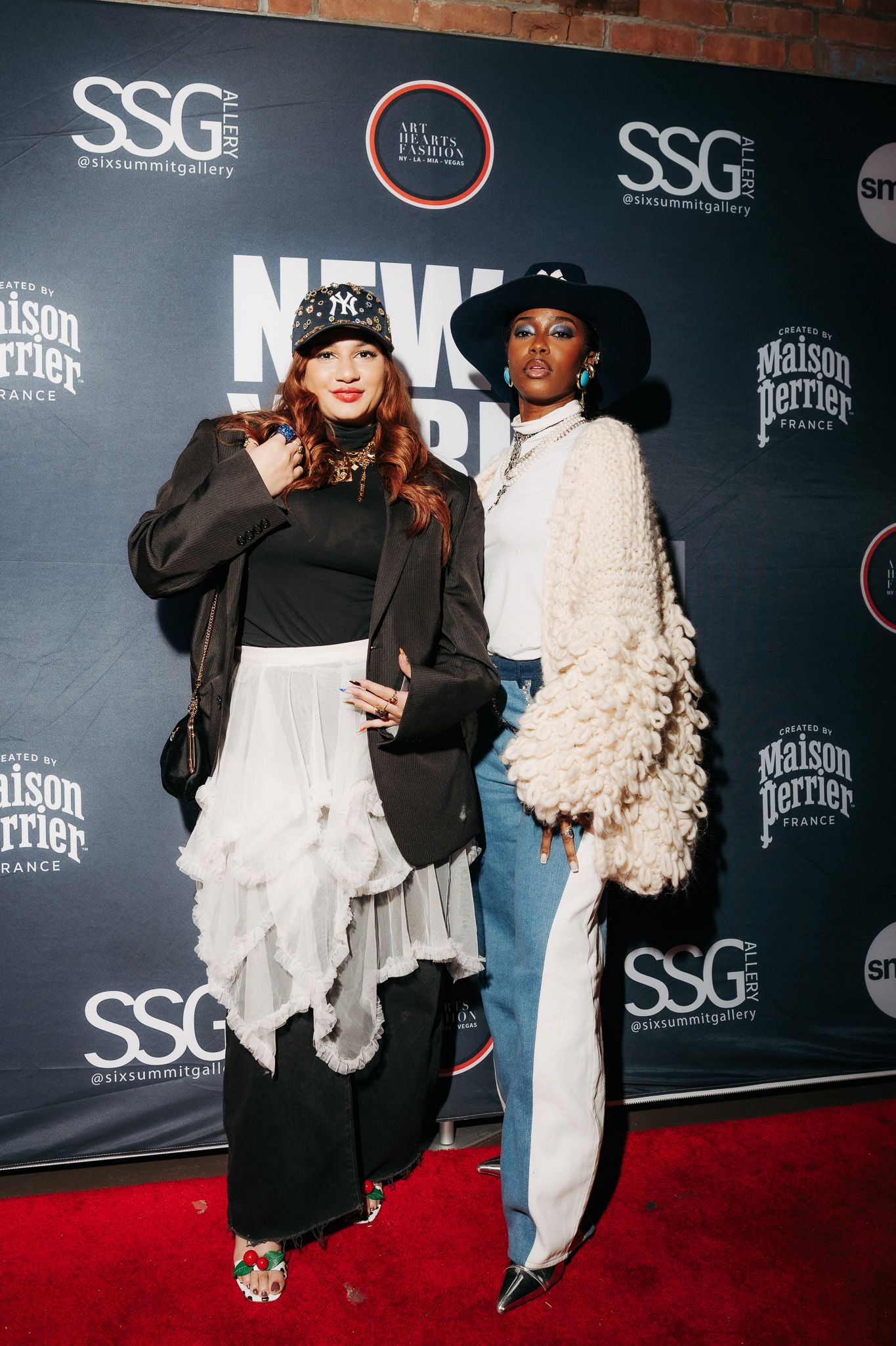 Multiple cameras capture a stylish red carpet event against a black backdrop with SSG and other brand logos.