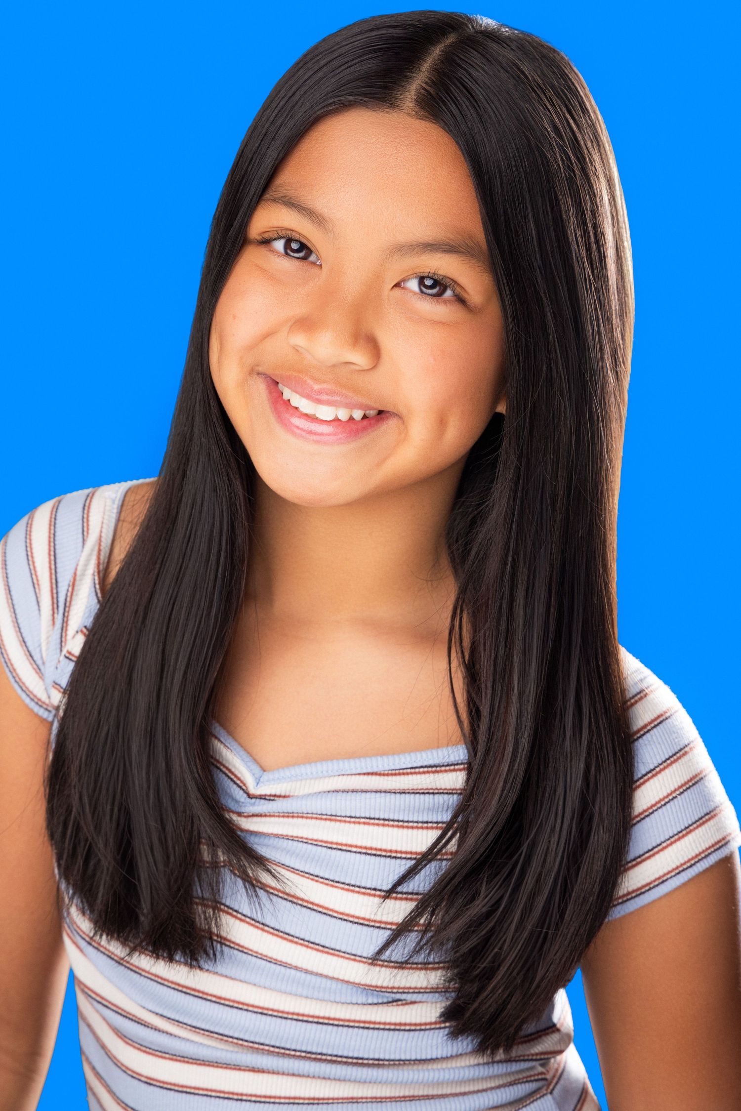 Portrait series showing different angles and expressions against bright blue background.