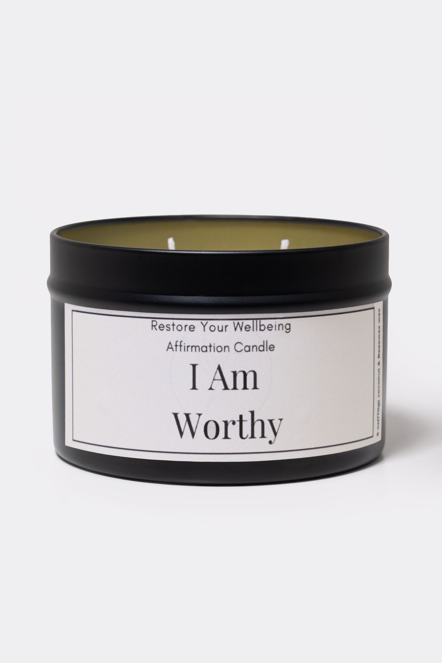 Black tin affirmation candle labeled I Am Worthy by Restore Your Wellbeing, featuring a white label and two wicks.