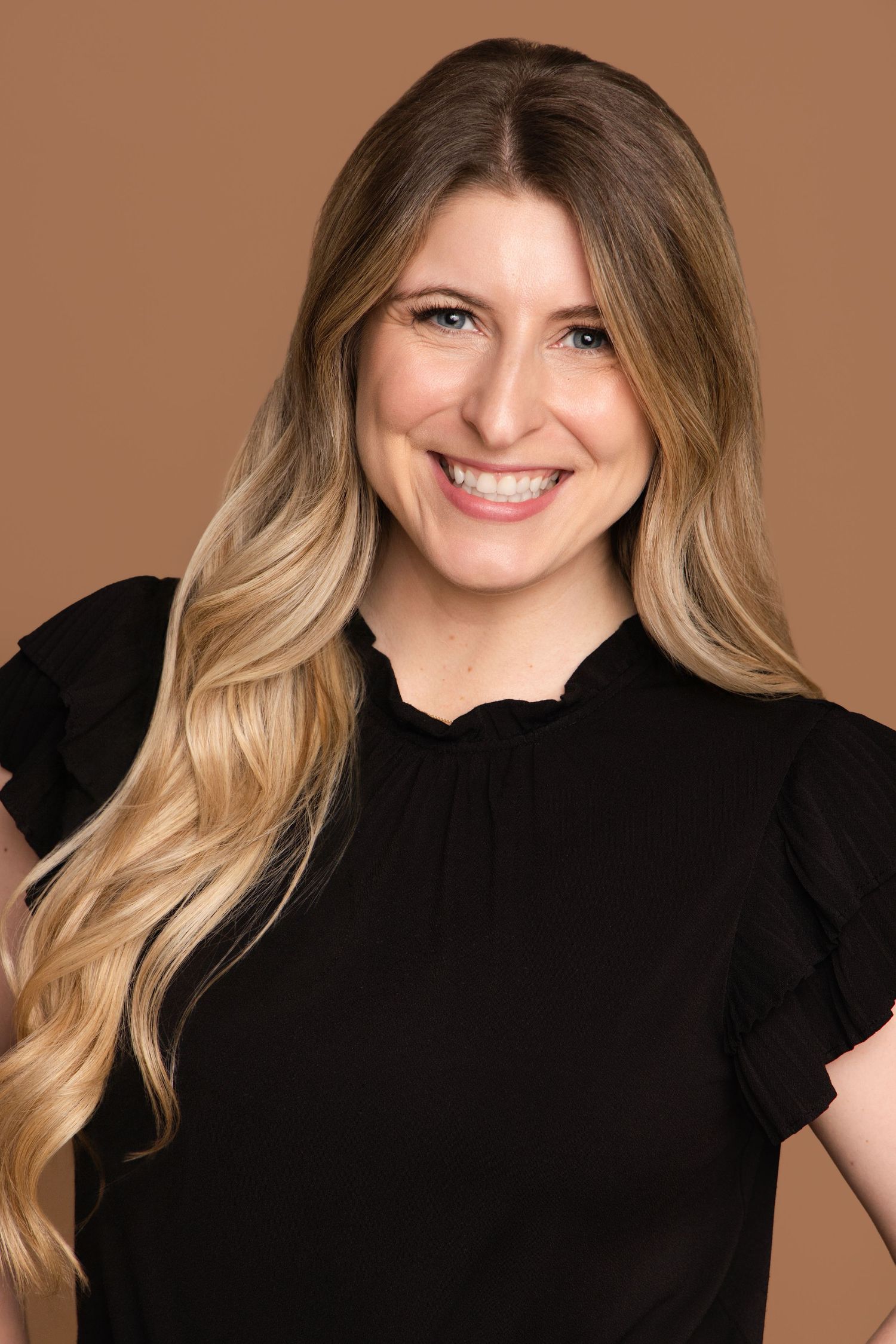 Professional headshot series showing a person with blonde wavy hair wearing a black top against a warm brown backdrop.